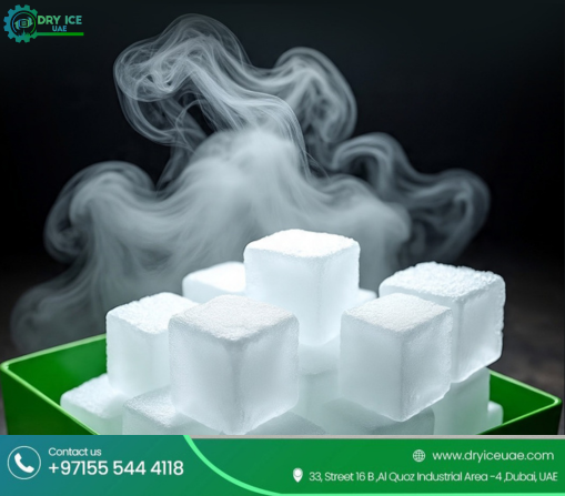 Premium dry ice cubes in a green container with thick sublimation vapor, illustrating industrial grade dry ice for Dubai businesses.